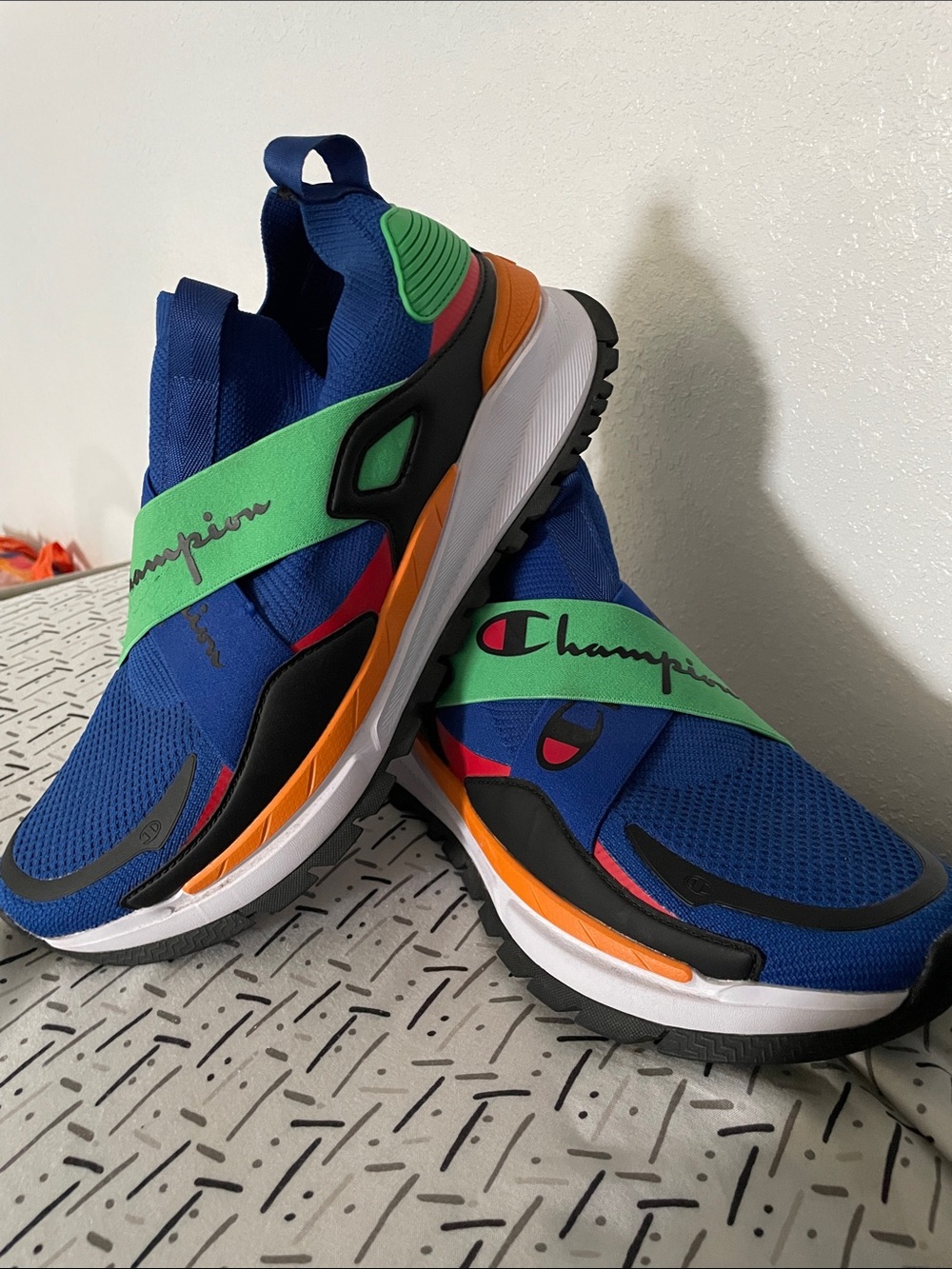 These are the vibrant blue and multi-color Champion Reflex X Low slip-on trainer
